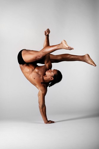 A dancer balanced on one hand