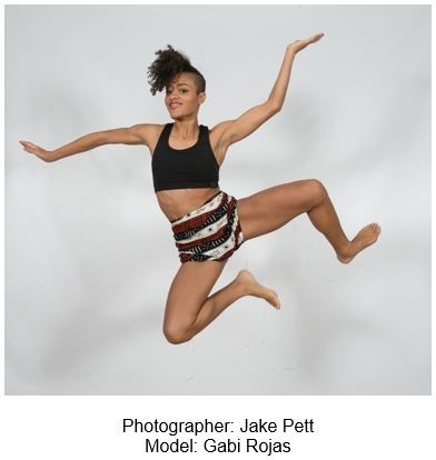 A dancer contorted mid jump