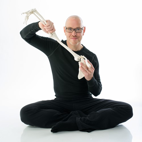 Brenton Surgenor posing with a skeletal arm